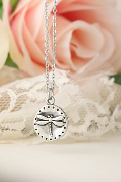 "This simple and elegant, yet truly stunning necklace features a hypoallergenic stainless steel dragonfly that measures approximately 5/8 Inch diameter. You can choose to have the back of this charm engraved with a SHORT messages (i.e. name, date, year, word, etc...) Please note, the MORE you have engraved on the back, the smaller the text is going to be as this is a small charm. Gift wrapping available at checkout for an added fee. Marking your item as a gift does NOT mean it gets gift wrapped, Adjustable Hypoallergenic Charm Necklace As Gift For Her, Hypoallergenic Adjustable Charm Necklace For Her, Adjustable Hypoallergenic Round Charm Necklace, Hypoallergenic Round Metal Charm Necklaces, Hypoallergenic Stainless Steel Round Necklace, Delicate Adjustable Nickel-free Charm Necklaces, Delicate Adjustable Nickel-free Charm Necklace, Adjustable Delicate Nickel-free Charm Necklace, Dainty Silver Dragonfly Jewelry