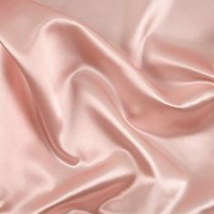 a close up view of a pink satin fabric