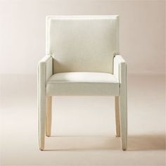 a white chair sitting on top of a floor