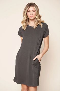 The Weekender T-Shirt Mini Knit Dress is ideal for any day of the week. This dress has a crew neckline, short sleeves, and best of all, pockets! With a relaxed shift dress fit and soft comfortable knit jersey fabric, you'll never want to take it off. Pair it with sneakers or cute sandals for an easy comfy look. T-shirt dress Comfy knit jersey fabric Short sleeve V Neckline Color: Charcoal Size + Fit Model is 5'9" and wearing size S Measurements are taken from size S Chest: 40 1/2" Length: 34" Se Jersey Knit Dress, Cute Sandals, Jersey Knit Fabric, Fit N Flare Dress, Dress With Pockets, Jersey Dress, Fitted Dress, Flare Dress, T Shirt Dress