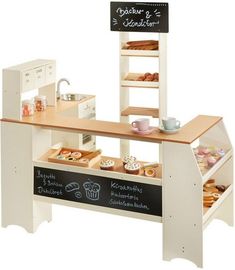 an image of a counter with food items on it and a chalkboard sign that says mustter kind