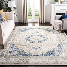 a living room filled with furniture and a large rug