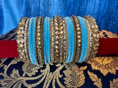 **Tej's Choice** Metal and velvet bangles with kare. These bangles sets are only available in sizes 2.4, 2.6, and 2.8 and are sold as a set for one hand. 2.4 size measures 2.25 inches in diameter2.6 size measures 2.375 inches in diameter2.8 size measures 2.5 inches in diameter Kundan Bangles, Bangle Set, Size 2, Bangles, Velvet