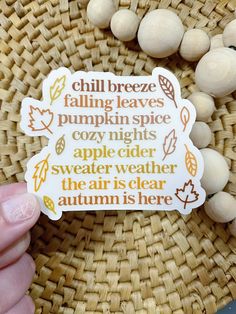 someone is holding up a sticker that says chill breeze falling leaves pumpkin spice cozy nights apple cider weather the air is clear autumn here