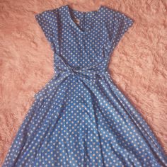 Super cute 60s era dress in blue with white polkadots. Polyester Measurements: 11.50' across waist total 23 inches Size 3 V neck Waist drop 16.5 Total length 39' Cap sleeve Neck line 7' Full skirt/ fitted waist Machine wash warm tumble dry Brand: Miss Kitty tag reads size 12 Excellent vintage condition Retro Polka Dot V-neck Dress, Retro V-neck Polka Dot Dress, 1950s Style A-line Polka Dot Dress, 1950s Style Polka Dot Dresses For Spring, Spring Polka Dot Vintage Dress, Vintage V-neck Polka Dot Dress, 1950s Style Polka Dot Knee-length Dress, 1950s Style Blue Spring Dress, Overall Outfit