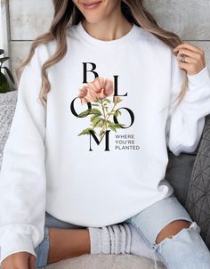 Floral Bloom Sweatshirt for Women - Inspirational Plant Quote, Comfy Cotton Pullover, Botanical Graphic Sweater, Garden Lover Gift, Casual .: Made with a medium-heavy fabric blend of 50% cotton and 50% polyester (8.0 oz/yd² (271.25 g/m this sweatshirt feels cozy and is the perfect choice for those colder months. .: The classic fit along with the crew neckline deliver a comfy wearing experience with a clean-cut style. Meanwhile, the double-needle stitching at the shoulder, armhole, neck, waistband, and cuff seams add top-tier durability.  .: Say goodbye to itchiness thanks to the gray, pearlized tear-away label.  .: Made using 100% ethically grown US cotton. Gildan is also a proud member of the US Cotton Trust Protocol ensuring ethical and sustainable means of production. The blank tee's dy Botanical Long Sleeve Tops With Plant Print, Spring Crew Neck Sweatshirt With Plant Print, White Tops With Plant Print For Fall, Garden Lover Gifts, Sweater Refashion, Crewneck Design, Graphic Sweaters, Sweatshirt For Women, Comfy Sweatshirt