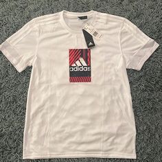 Nwt Mens Adidas Shirt Size Large. In Brand New Condition! White Graphic Print Sports Shirt, White Graphic Print Shirt For Sports, Adidas White Sports T-shirt, White Casual Adidas Shirt, Casual White Adidas Shirt, Adidas White Short Sleeve T-shirt, White Adidas T-shirt Short Sleeve, Adidas White Short Sleeve Tops, White Adidas T-shirt With Short Sleeves