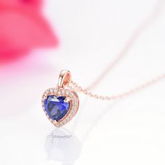 Beautiful Heart-Shaped Tanzanite Pendant Necklace ►Base Metal: Sterling Silver (925) ►Plating: 14K Rose Gold ►Accented with simulated diamonds (CZ) Center Stone: Tanzanite Shape: Heart Gemstone creation: Simulated Measurements: 9.0 mm Carat Weight: 1.8 ct. (approx.) Hardness: 8 (Mohs scale) ►Please be aware that plated jewelry can wear off over time, if this is a concern we would suggest going with the sterling silver or solid gold jewelry option ✓ Free Gift Box ✓ Free USA Shipping ✓ Free chain Elegant Heart Cut Birthstone Jewelry, Classic Necklace For Anniversary With May Birthstone, Anniversary Sapphire Jewelry With Heart Charm, Rose Gold Jewelry With Halo Setting For Anniversary, Elegant Sapphire Necklaces For Valentine's Day, Classic May Birthstone Necklace For Anniversary, Rose Gold Halo Setting Jewelry For Anniversary, Anniversary Rose Gold Jewelry With Halo Setting, Elegant Valentine's Day Jewelry With Halo Setting