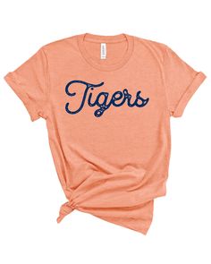 Tigers Stamped Gameday Tee College Varsity T-shirt With Graphic Print, Varsity T-shirt With Team Name For Baseball Season, Varsity T-shirt For College Football Season, Varsity Logo Print T-shirt For Game Day, Game Day T-shirt With Screen Print For Sports Season, Team Spirit T-shirt With Letter Print For Fans, Cotton Varsity T-shirt With Lettering, Casual T-shirt With Lettering For Game Day, Varsity T-shirt With Team Name For College