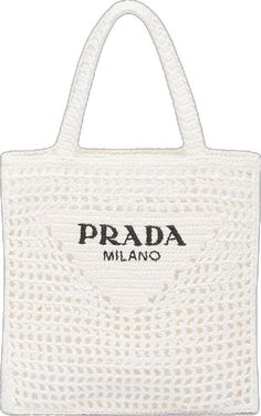 a white bag with the word prada in black on it and an embroidered logo