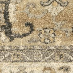 an area rug with many different colors and patterns on it, including brown, beige, black