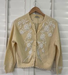 Excellent vintage condition. All beads are intact. No missing or loose beads. No missing buttons. One small stain on back. See photos. Vintage Cream Embroidered Cardigan, Vintage Embroidered Cream Cardigan, Wool Cardigan, Hand Beading, Loose Beads, Cardigans For Women, Sweater Outfits, Sweaters & Cardigans, Favorite Outfit