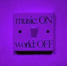 a purple light switch cover with the words music on world off written in black letters