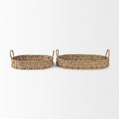 two woven baskets with handles on white background