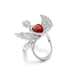 Exquisite and eye-catching, this angel wing ring is destined to be treasured. The angel-inspired design showcases a heart-shaped red stone in the center and a pear-cut white stone (symbolizing the angel’s face) with a half halo around. Her wings feature the rib-textured feathers with small shining white stones completing the style. The timeless piece flutters as you bend your finger, which radiates peace, harmony and charm. The angel's wings will wrap your heart in infinite security. Carat Weigh Elegant Winged Rings As Gifts, Elegant Winged Rings For Gifts, Elegant Sterling Silver Winged Rings, Luxury Red Heart Ring As Gift, Luxury Red Heart Ring Gift, Flying Angel, Wing Ring, Angel Wing Ring, Angel S