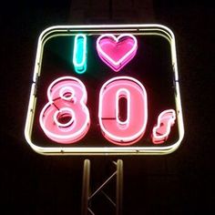 a neon sign that says i love 80's with hearts and the number 80 on it