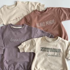 So very buttery and cozy! These are made from 95% organic cotton and 5% spandex. Customize with your little one's first name, monogram initials or text of your choice. Choose from 6 different shades and a ton of different thread colors and fonts. All text will be embroidered on the center of the sweatshirt unless you otherwise specify. These sweatshirt rompers are intended to be oversized fit. The text will automatically be stitched on one line. If you would like it on two lines or if you would Cream Tops With Letter Embroidery For Fall, White Organic Cotton Tops With Ribbed Cuffs, Cream Cotton Tops With Letter Embroidery, Cream Cotton Top With Letter Embroidery, Crew Neck Tops With Name Print For Loungewear, Customizable Cotton Sweatshirt For Loungewear, Customizable Family Matching Cotton Sweatshirt, Cotton Tops With Letter Embroidery For Loungewear, Personalized Family Matching Sweatshirt For Fall