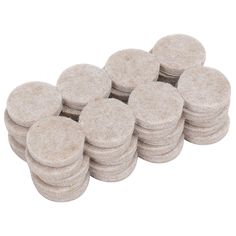 a pile of white round stone coasters on a white background