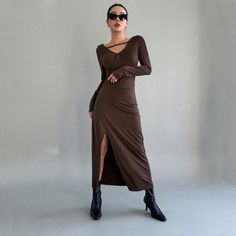 Introducing our Chic French High Sense Adult Lady-Like Brown Knitted Maxi Dress, a sophisticated and stylish addition to your wardrobe. This dress is crafted for the modern woman, offering a high sense of fashion with a chic French touch.Crafted with meticulous attention to detail, the brown knitted fabric adds warmth and texture, creating a luxurious and comfortable ensemble. The maxi dress features hollow-out cutouts and a slit, adding a touch of allure and contemporary elegance. The slim fit silhouette with a V-neck and hip detailing enhances your curves, providing a confident and chic appearance.Ideal for various occasions, this dress seamlessly combines sophistication and style. Whether you're attending a special event, a dinner party, or a chic gathering, this dress is the perfect ch Draped Bodycon Dress, Spring Break Outfit, Knitted Maxi Dress, Women Long Sleeve Dress, Red Lace Midi Dress, Sequin Party Dress, Outfit Inspo Spring, French Women Style, Chic Maxi Dresses