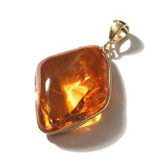 A sparkling golden honey cognac amber "from the gods!" This is a divine large thick pendant Stone: Honey Cognac Baltic Amber Dimensions: Amber stone is approx. 2" long & 1 1/2" wide & 1/2" thick (depth) Length: Pendant hangs approx. 2 1/2" Material: Gold Plated .925 Sterling Silver Made in: Poland Luxury Amber Necklace For Wedding, Luxury Gold Necklace With Baltic Amber, Luxury Elegant Amber Necklaces, Luxury Baltic Amber Necklace, Luxury Citrine Amber Necklace, Golden Honey, Amber Stone, Statement Pendant, Baltic Amber