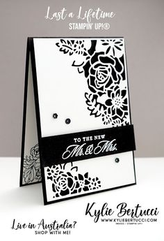 a card with black and white flowers on it