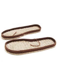 two crocheted slippers with brown trims on white background, one is open and the other is closed