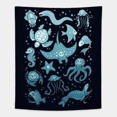 an ocean scene with sea animals and fish on a black wall hanging in front of a white background