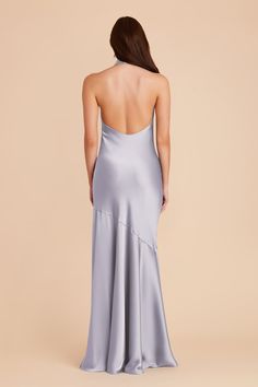 the back of a woman in a grey dress