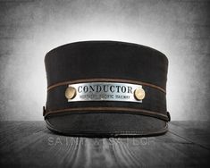 a black hat with the words conductor on it