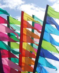 colorful flags blowing in the wind on a sunny day