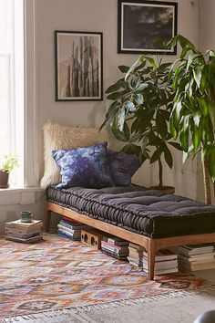 an image of a couch with pillows on it in the middle of a living room