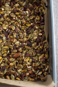 a baking dish filled with nuts and raisins