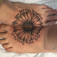 two people with tattoos on their feet that say, you are my sunshine and nothing else