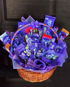 a basket filled with lots of purple candy