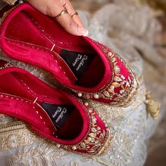 Step into everlasting bliss with DulhansDiary's double-padded red velvet bridal Khussa, where elegance meets comfort. Our bridal Khussas are expertly made with care to every last detail. The plush velvet interior not only envelops your feet in luxury relaxation but also gives your wedding journey a touch of regal splendor. These khussas make sure you walk with grace and assurance whether you're exchanging vows at the nikkah or celebrating at the walima, making your moments genuinely unforgettabl Bridal Khussa, Luxury Relaxation, Proper Attire, Punjabi Jutti, Velvet Interior, Red Flats, Velvet Interiors, Thick Socks, Womens Wedding Shoes