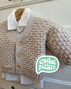 a knitted sweater hanging on a clothes hanger with the words crochet pattern below it