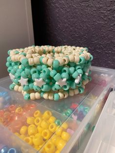 a plastic container filled with lots of beads