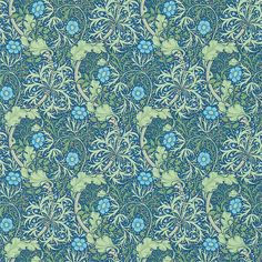 a blue and green wallpaper with flowers on it