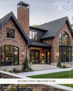 the front view of a brick house with large windows