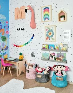 children's playroom with toys and decorations on the wall