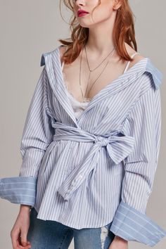 Details This long and flowy top adds a twist to the usual button-up style. - Off the shoulder design - Vertical and horizontal strip pattern - Tie attached - Button closure in front Content + Care - 100% Cotton - Dry clean Size + Fit Model is 5'8" and wearing size Onesize Festival Ootd, Strip Pattern, Ootd Dress, Flowy Top, Festival Looks, Spring Looks, Flowy Tops, Classic Dress, Shoulder Design