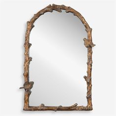 a mirror that is made out of wood and has branches on the frame, as well as