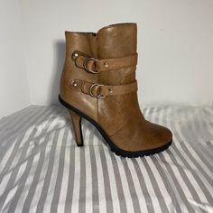 Color: Oil Rubbed Taupe Size: 6.5m Heel Height: 4" Features: Inside Zipper Double Buckle Detail Silver Hardware Rubber Lug Sole New & Never Worn **Small Scuff On Back Of Right Shoe Above Heel (See Pics) Brown High Heel Boots With Padded Ankle, Brown High Heeled Boots With Padded Ankle, Brown Ankle Boots With Padded Ankle, Brown Padded Ankle Boot Heels, Ankle-high Heeled Boots With 4-inch Heel In Faux Leather, Ankle-high Faux Leather Heeled Boots With 4-inch Heel, Medium Width High Heel Faux Leather Booties, Brown Ankle-high Boots With 4-inch Heel, Brown High Heel Platform Boots With Padded Ankle