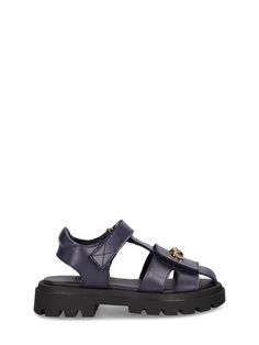 Leather upper. Adjustable strap closure. Logo details. Treaded rubber sole Designer T-strap Sandals With Buckle Closure, Luxury Leather T-strap Sandals With Buckle Closure, Versace Logo, Gold Girl, Girls Shoes Kids, Walker Shoes, Navy Gold, Stella Mccartney Kids, Gold Leather