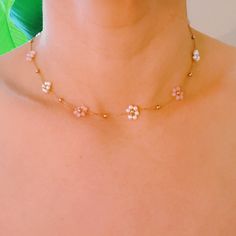 This delicate necklace features glass and pearl bead flowers, adding a touch of elegance to any outfit. The dainty chain completes the look, making it perfect for both formal occasions and everyday wear. Dimensions: approximately 14.5" with a 2" extender 18k gold plated stainless steel with water and tarnish resistant finish Lead and Nickel free Crafted in China Bead Flowers, Stylish Scarves, Hair Setting, Dainty Chain, Flower Field, Delicate Necklace, Scrunchie Hairstyles, Steel Jewelry, Stainless Steel Jewelry