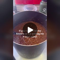 a pot filled with food sitting on top of a counter