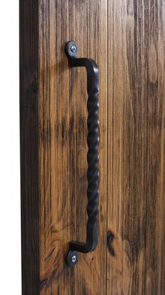 a wooden door with a metal handle on it