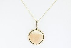 14k Solid Gold Engravable Disc Charm, Real Gold Disc Pendant, Round Sunlight Charm, Premium Necklace For Her. All of the materials including pendant and chain are 14k Solid Gold.  Dimensions - Chain width: 1.20 mm.  Pendant Width: 19.4 mm.  Pendant Height: 28.2 mm. 💙 Our jewelry is handcrafted with love and great care at San Francisco Bay! All of our items are 14k stamped for authenticity. 💙 You will receive them exactly as pictured. We don't use any filters, all photos are authentic and unedited. 💙 The material is 14k solid gold and should not be confused with gold plating or filling. It won't tarnish or fade over time. 💙 Our chain is a special diamond cut chain with 1.20 mm thickness. It's dainty and sturdy. We're offering the finest quality in solid gold jewelry. 💙 Quick shipping -