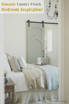 a bedroom with a bed, dresser and chandelier hanging from the ceiling in front of a mirror