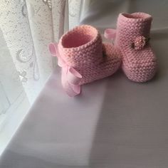 Knitted baby booties - 0-6 month ,pink It is made out of 100% acrylic yarn.  Made in a pet and smoke free home.  Perfect for a baby shower gift, birth announcement, or that precious newborn in your life. They are very soft and will keep your baby's feet warm and cozy. CARE INSTRUCTIONS: Machine wash using the gentle cycle or handwash with cold water. Do not bleach. Be sure to tumble dry using very low heat only and do not over dry. Cute Pink Booties With Soft Sole, Cute Pink Booties For First Birthday, Cute Pink First Birthday Booties, Pink Round Toe Booties For First Birthday, Cute Soft Sole Booties As Gift, Pink Crochet Booties With Round Toe, Cute Handmade Pink Booties, Pink Crochet Round Toe Booties, Pink Booties With Soft Sole For Gift